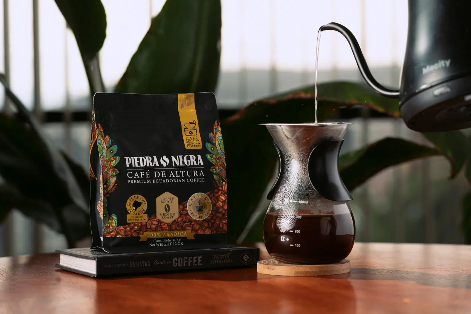 Medium Roast bag beside a freshly brewed pour-over coffee
