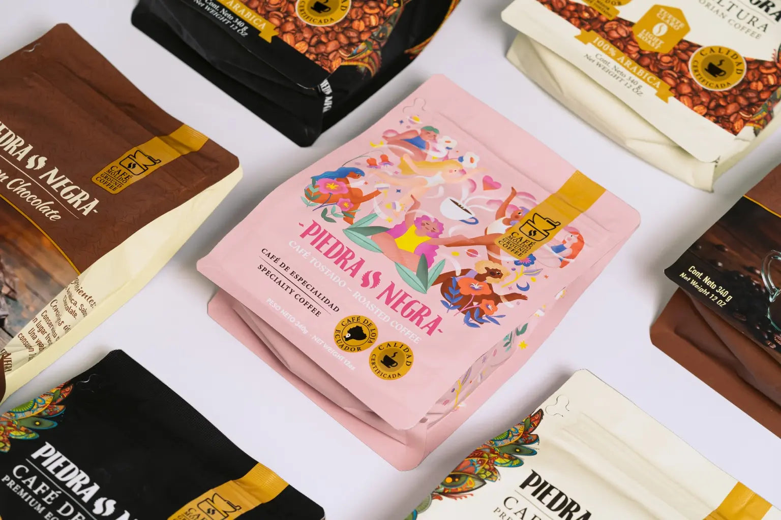 Specialty Selection pink coffee bags surrounded by the Piedra Negra collection